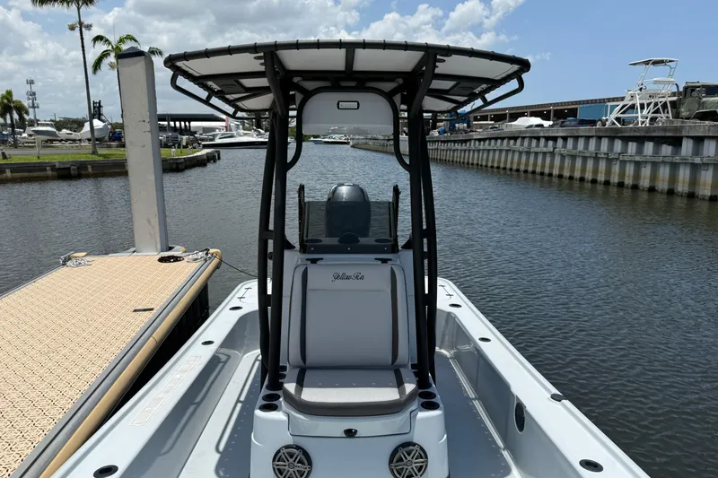 Slide: The Image of 2017 Yellowfin 24 Bay CE boat docked at marina under clear sky. - 20