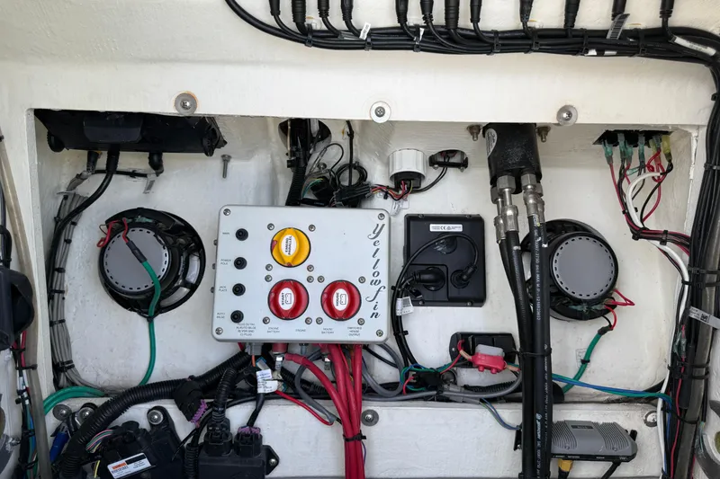 Slide: The Image of Electrical panel of a 2017 Yellowfin 24 Bay CE boat, showcasing wiring and components. - 22