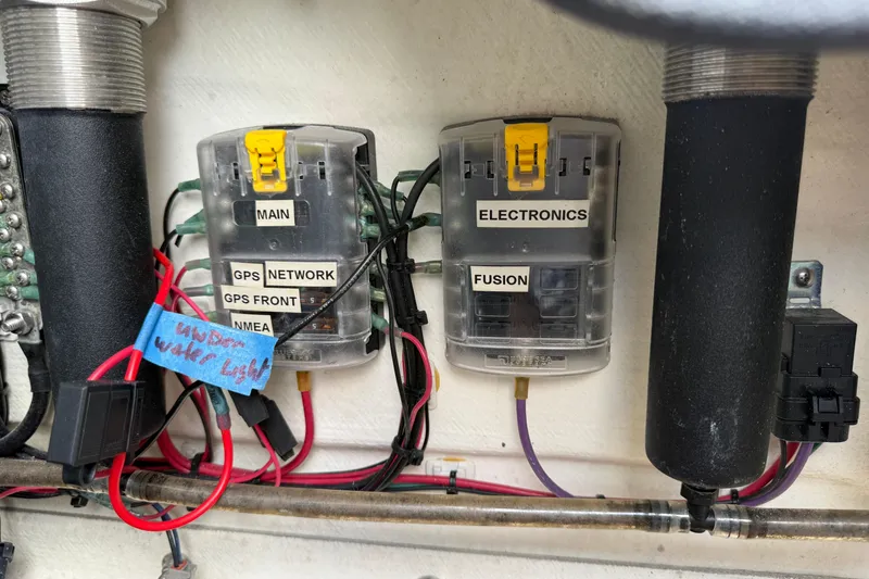 Slide: The Image of Electrical panel with labeled circuits on a 2017 Yellowfin 24 Bay CE boat. - 27