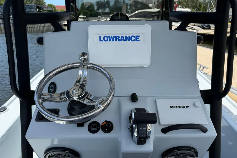 Slide: The Image of 2017 Yellowfin 24 Bay CE boat console with Lowrance and Mercury controls. - 33