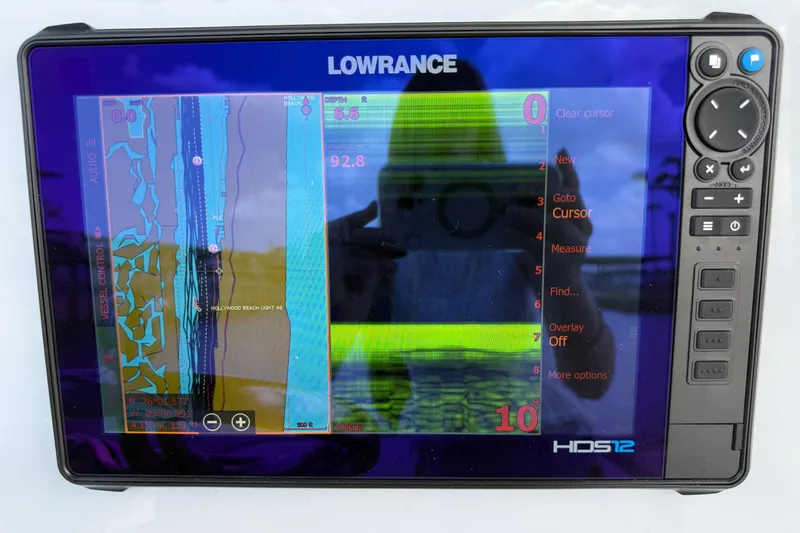 Slide: The Image of Lowrance HDS12 display on 2017 Yellowfin 24 Bay CE boat, showing navigation and sonar data. - 35