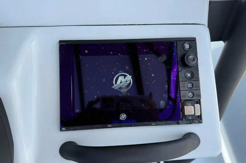 Slide: The Image of Control panel of a 2017 Yellowfin 24 Bay CE boat with electronic display. - 36