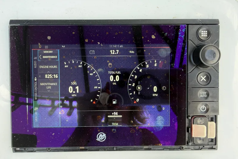 Slide: The Image of Dashboard display of a 2017 Yellowfin 24 Bay CE boat showing engine metrics. - 37