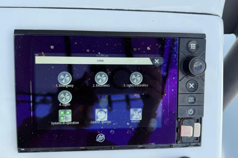 Slide: The Image of Touchscreen control panel on a 2017 Yellowfin 24 Bay CE boat displaying system options. - 38