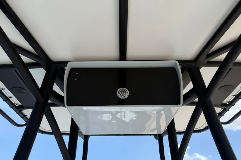 Slide: The Image of 2017 Yellowfin 24 Bay CE boat T-top with storage compartment, viewed from below. - 42