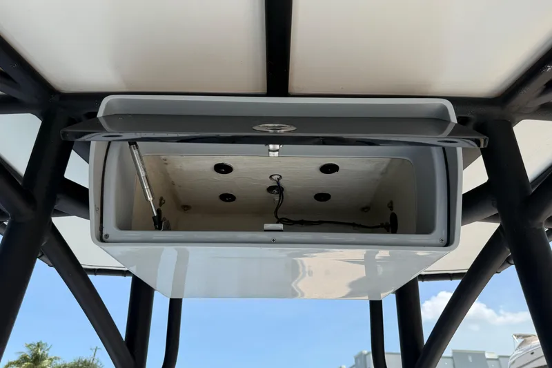 Slide: The Image of Open storage compartment on 2017 Yellowfin 24 Bay CE boat, showcasing interior details. - 44