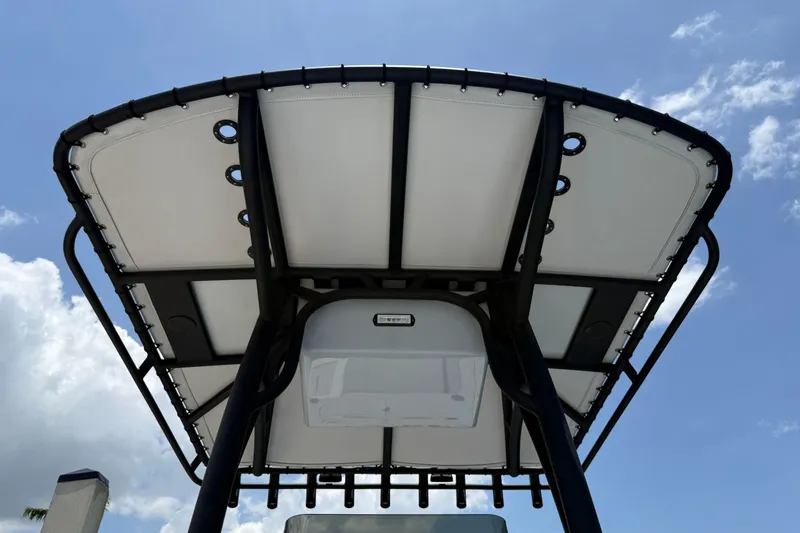 Slide: The Image of 2017 Yellowfin 24 Bay CE boat canopy against blue sky. - 46