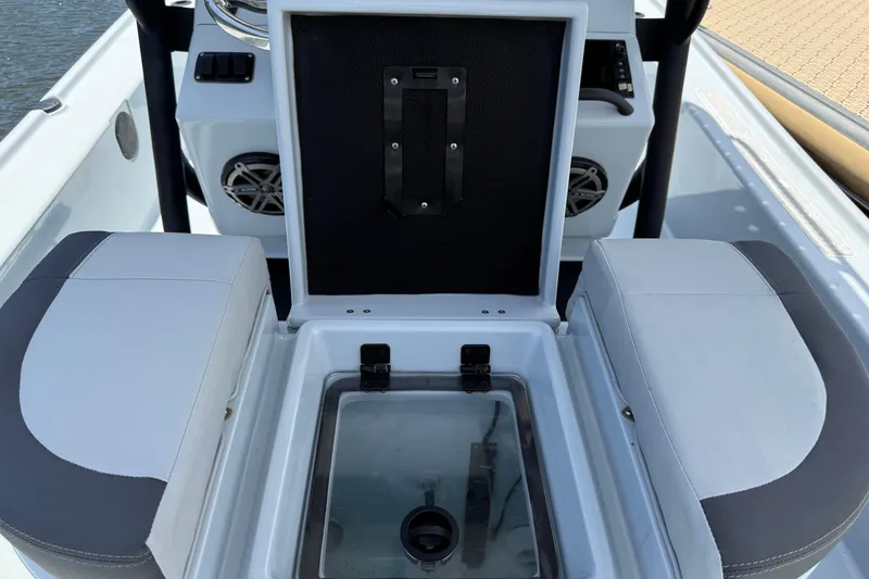 Slide: The Image of 2017 Yellowfin 24 Bay CE boat interior with open storage compartment. - 53