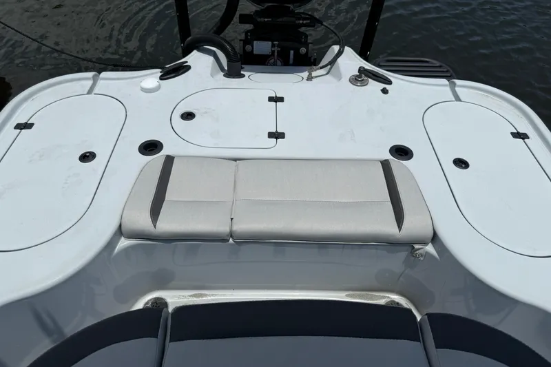 Slide: The Image of 2017 Yellowfin 24 Bay CE boat interior with seating and storage compartments. - 57