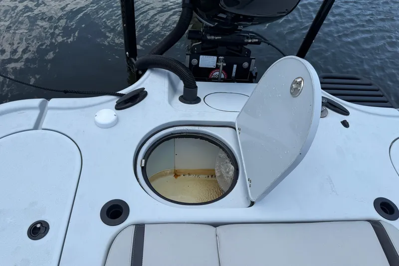 Slide: The Image of 2017 Yellowfin 24 Bay CE boat with open storage compartment on deck. - 61