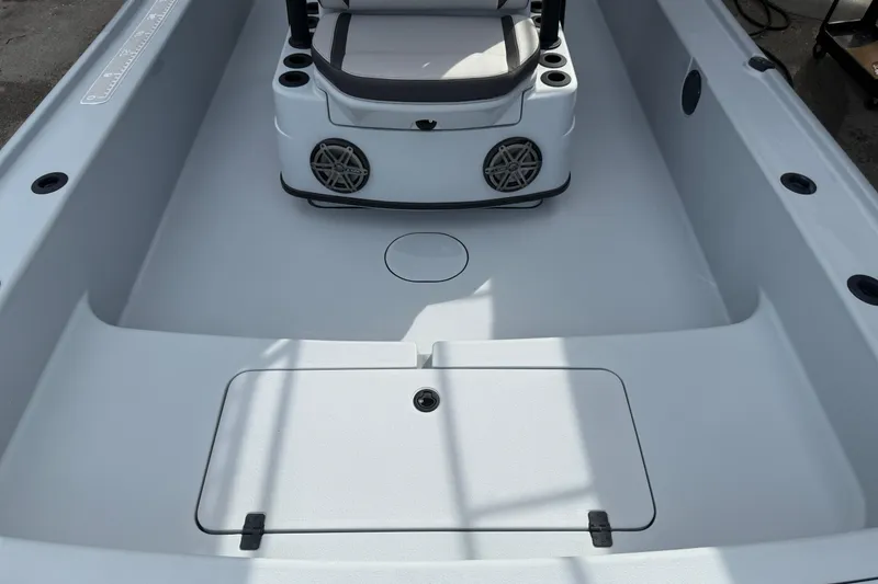 Slide: The Image of 2017 Yellowfin 24 Bay CE boat interior with seating and storage compartments. - 71
