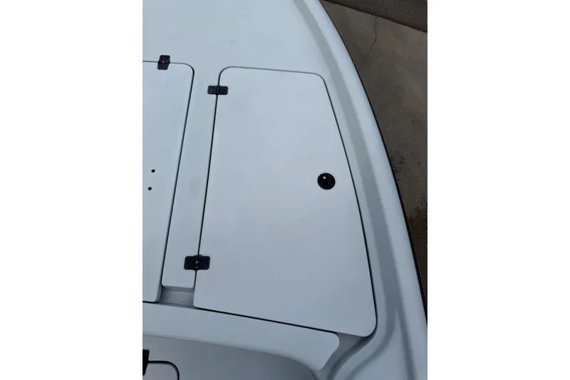 Slide: The Image of 2017 Yellowfin 24 Bay CE boat deck with storage hatch. - 74