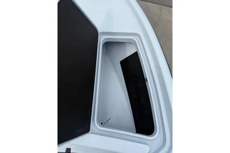 Slide: The Image of Storage compartment of a 2017 Yellowfin 24 Bay CE boat, featuring a sleek design. - 75