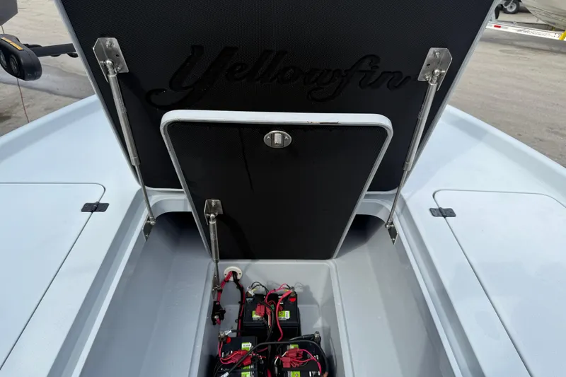Slide: The Image of 2017 Yellowfin 24 Bay CE boat battery compartment with open hatch. - 80