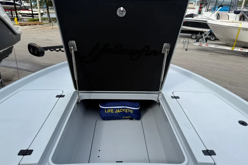 Slide: The Image of 2017 Yellowfin 24 Bay CE boat storage compartment with life jackets inside. - 81