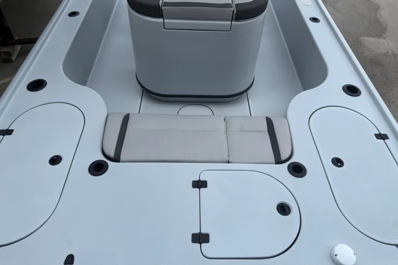 Slide: The Image of 2017 Yellowfin 24 Bay CE boat deck with seating and storage compartments. - 84