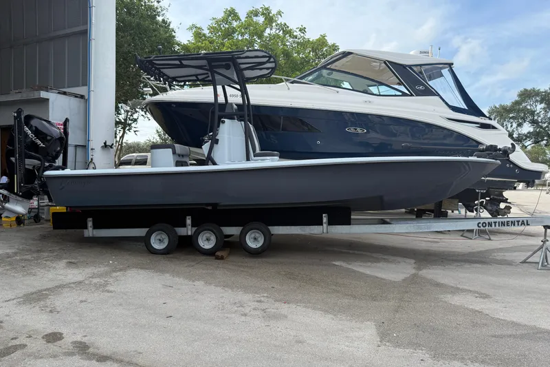 Slide: The Image of 2017 Yellowfin 24 Bay CE boat on trailer, parked outdoors. - 85