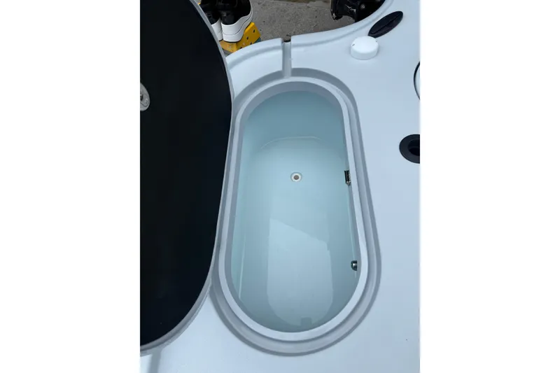 Slide: The Image of Open storage compartment on 2017 Yellowfin 24 Bay CE boat. - 88
