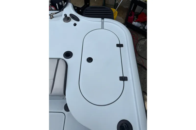 Slide: The Image of 2017 Yellowfin 24 Bay CE boat deck with storage compartment and seating. - 89