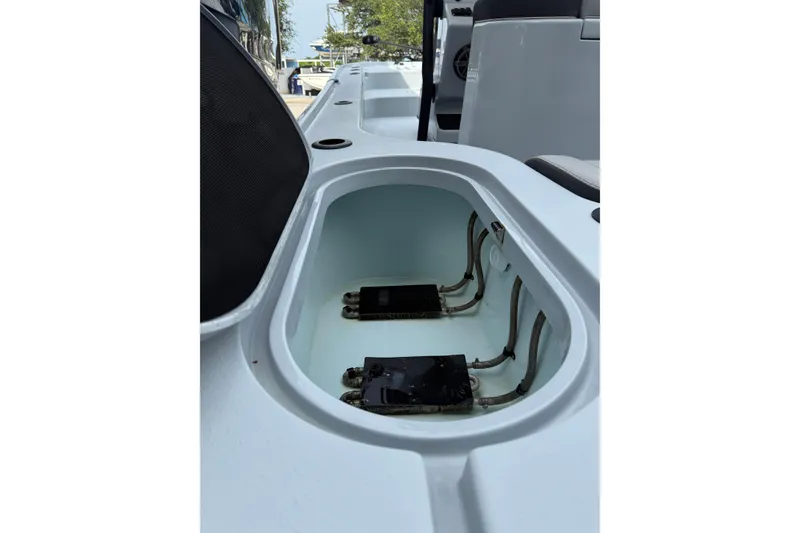 Slide: The Image of 2017 Yellowfin 24 Bay CE boat compartment with wiring and components. - 94