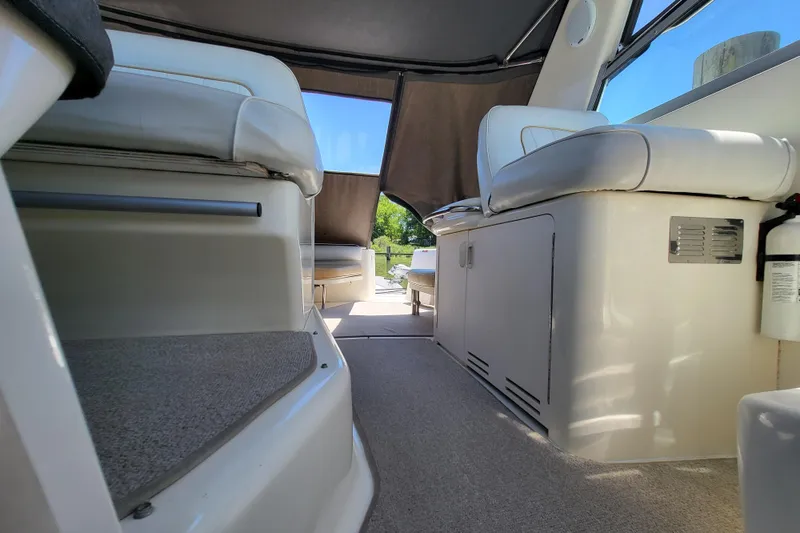 Slide: The Image of Interior view of 1995 Sea Ray Sundancer 370 yacht with seating and carpeted flooring. - 10