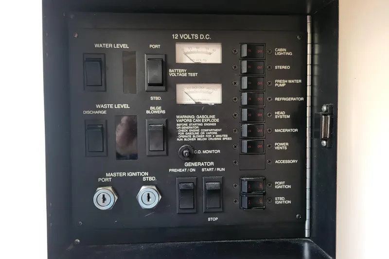 Slide: The Image of Control panel of a 1995 Sea Ray Sundancer 370 boat, featuring various switches and gauges. - 20