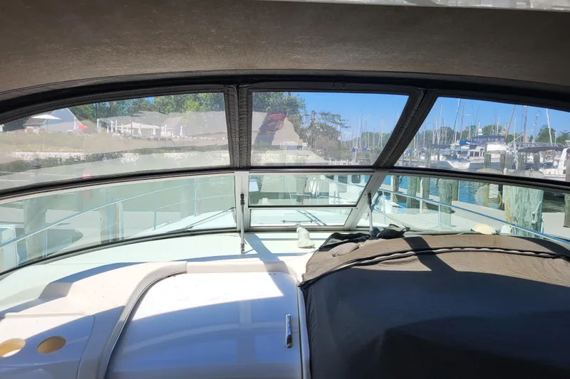 Slide: The Image of Interior view of 1995 Sea Ray Sundancer 370 yacht docked at a marina. - 23