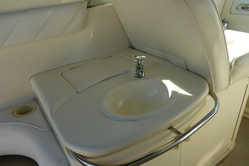 Slide: The Image of Interior sink area of 1995 Sea Ray Sundancer 370 yacht with white upholstery. - 32