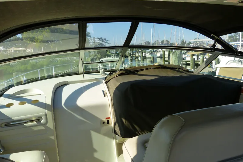Slide: The Image of Interior view of a 1995 Sea Ray Sundancer 370 yacht at a marina. - 33