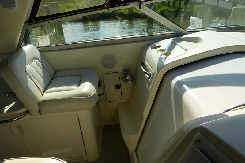 Slide: The Image of Interior view of a 1995 Sea Ray Sundancer 370 boat with seating and control panel. - 40