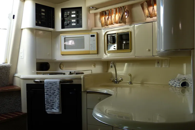 Slide: The Image of Interior of 1995 Sea Ray Sundancer 370 yacht kitchen with microwave and sink. - 41