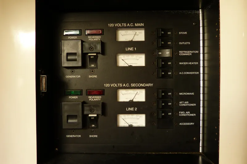 Slide: The Image of Electrical panel of a 1995 Sea Ray Sundancer 370 boat, showing switches and meters. - 45