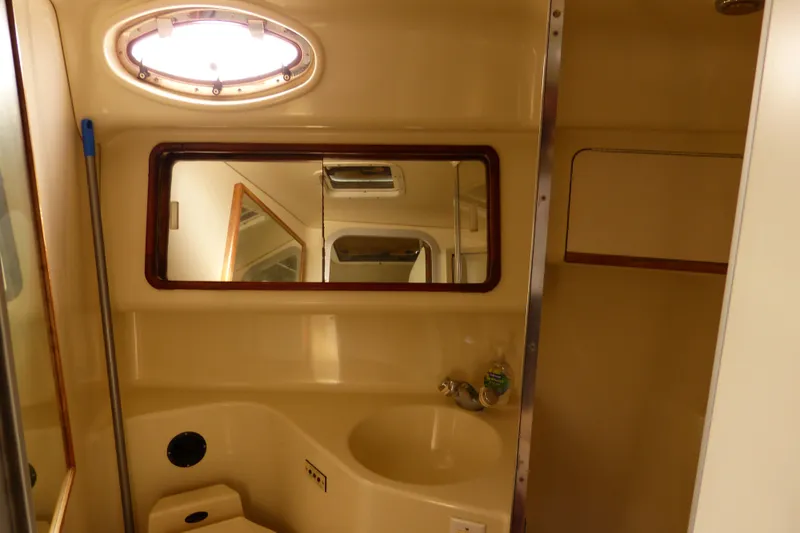 Slide: The Image of Bathroom interior of 1995 Sea Ray Sundancer 370 yacht, featuring sink and mirror. - 47