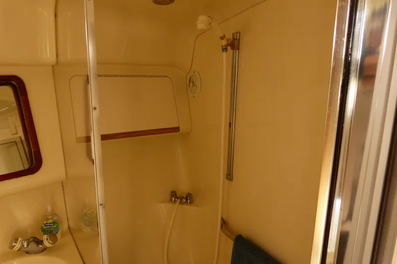 Slide: The Image of Bathroom interior of 1995 Sea Ray Sundancer 370 yacht, featuring shower and sink. - 48