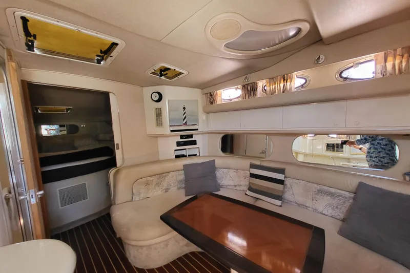 Slide: The Image of Interior of 1995 Sea Ray Sundancer 370 yacht with cozy seating and modern amenities. - 5