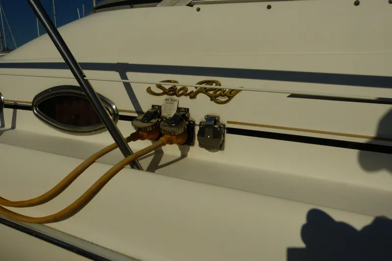 Slide: The Image of 1995 Sea Ray Sundancer 370 boat with power connections and logo detail. - 51