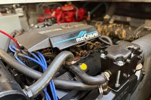 Slide: The Image of MerCruiser engine in a 1995 Sea Ray Sundancer 370 boat, showcasing detailed components. - 54