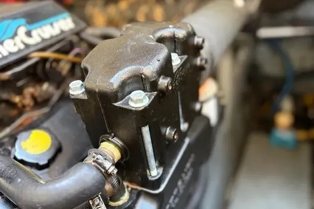 Slide: The Image of Close-up of a 1995 Sea Ray Sundancer 370 engine component. - 56