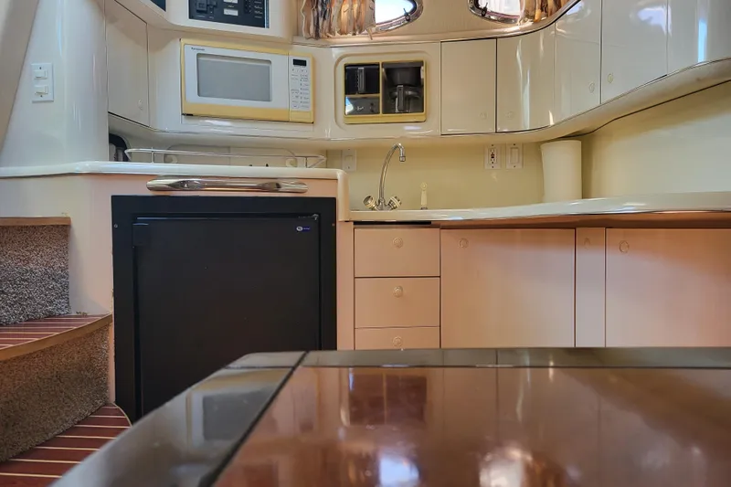 Slide: The Image of Interior of 1995 Sea Ray Sundancer 370 yacht kitchen with microwave and sink. - 6