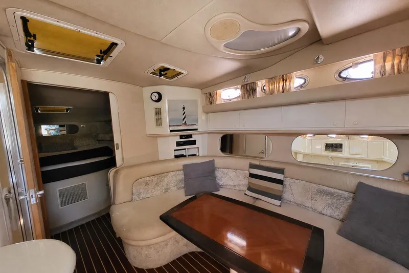 Slide: The Image of Interior of a 1995 Sea Ray Sundancer 370 yacht with cozy seating and elegant decor. - 60