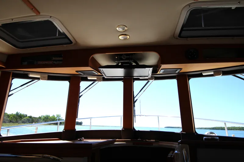 Slide: The Image of Interior view of 2013 Ranger Tugs R-31 CB boat with scenic water backdrop. - 11