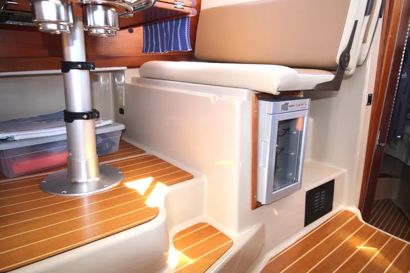 Slide: The Image of 2013 Ranger Tugs R-31 CB interior with seating and compact refrigerator. - 21