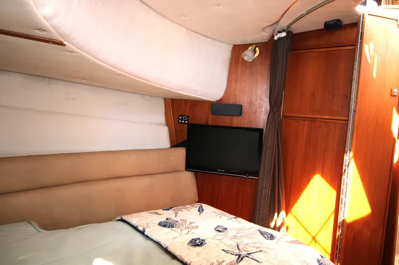Slide: The Image of Interior cabin of 2013 Ranger Tugs R-31 CB with TV and cozy bedding. - 23