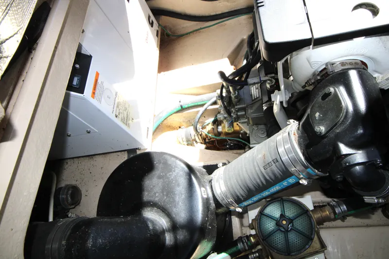Slide: The Image of Engine compartment of 2013 Ranger Tugs R-31 CB, showcasing mechanical components and systems. - 38