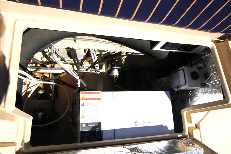 Slide: The Image of Engine compartment of 2013 Ranger Tugs R-31 CB with visible wiring and components. - 42