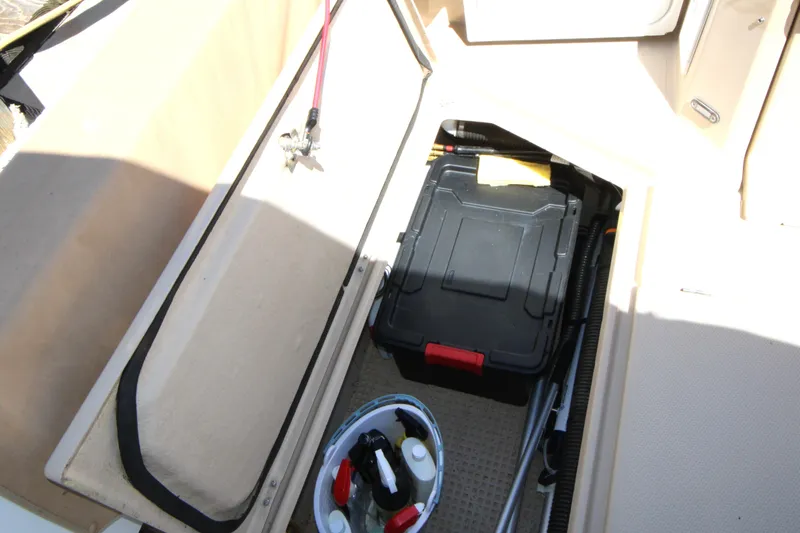 Slide: The Image of Storage compartment on 2013 Ranger Tugs R-31 CB boat with tools and cleaning supplies. - 45