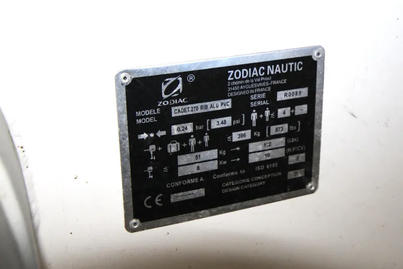 Slide: The Image of Zodiac Nautic model plate on Ranger Tugs R-31 CB, 2013, displaying specifications and serial number. - 49
