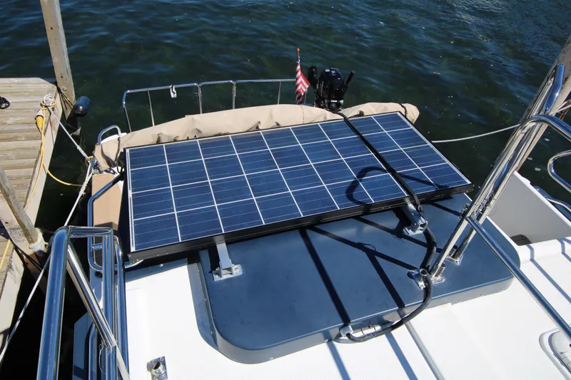 Slide: The Image of Solar panel on 2013 Ranger Tugs R-31 CB boat deck, docked by water. - 8