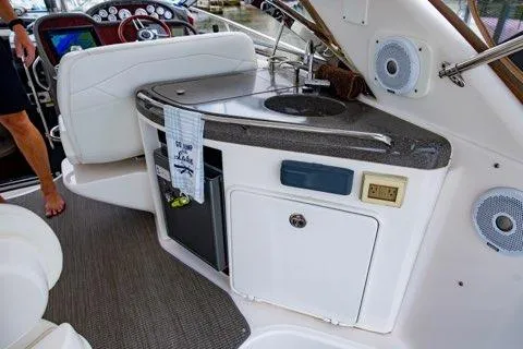 Slide: The Image of 2008 Regal Commodore 3860 yacht interior with kitchenette and modern amenities. - 10