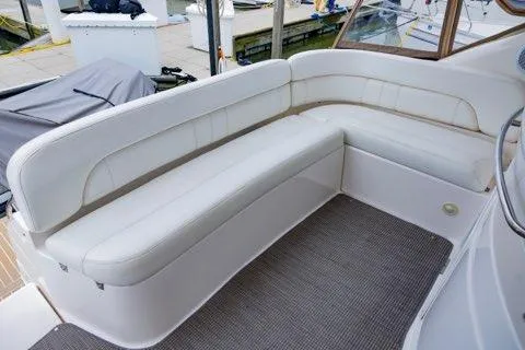 Slide: The Image of 2008 Regal Commodore 3860 yacht with white cushioned seating on deck. - 5